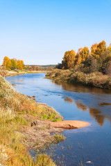 Naklejka premium Autumn blue sky bend in the river with sandy bank in Vologodskaya oblast, Russia