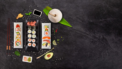 Japanese sushi set on black stone background