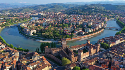 Aerial drone photo from iconic fortified medieval castle and bridge of Castelvecchio used as a museum, Verona, Italy - obrazy, fototapety, plakaty