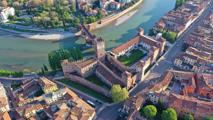 Obraz premium Aerial drone photo from iconic fortified medieval castle and bridge of Castelvecchio used as a museum, Verona, Italy
