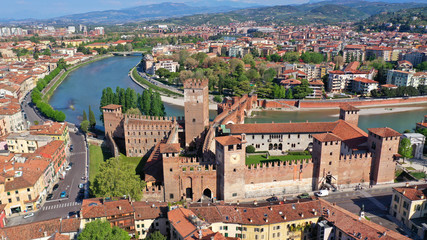 Aerial drone photo from iconic fortified medieval castle and bridge of Castelvecchio used as a museum, Verona, Italy