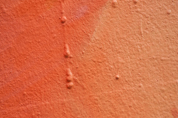 closeup of orange painting on the wall texture