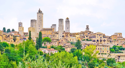 Fototapeta na wymiar View of the historic cityscape of San Gimignano facing the countryside in Tuscany, Italy.