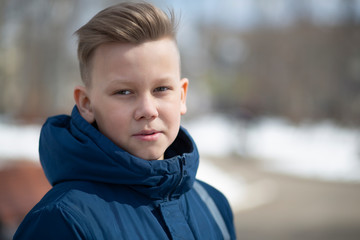 Portrait of a child on a city street.