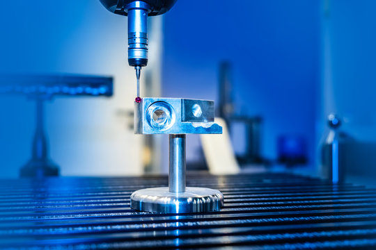 Measuring machine with a manipulator arm. Three-dimensional coordinate measurement. Check sizes. 3D check of the sizes of parts. CMM after machining process in industrial factory