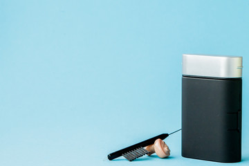 Box with hearing aid and accessories on color background. Medical, pharmacy and healthcare concept....
