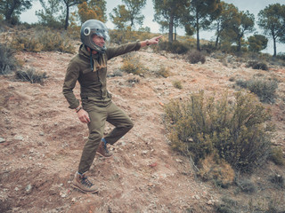 attractive man in the field wearing aviation clothes