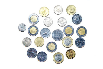 Old, invalid coins from Italy isolated on a white background. 