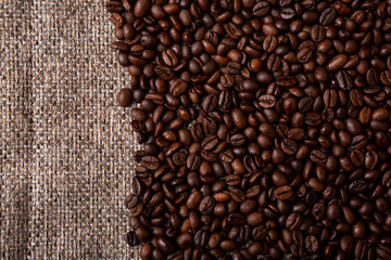 Coffee beans and sackcloth background., place for text
