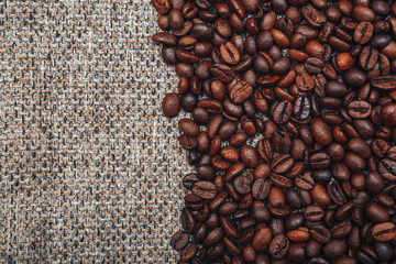 Coffee beans and sackcloth background., place for text