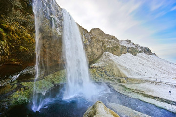 View of Seljalandsfoss waterfall in the morning in winter in Iceland.