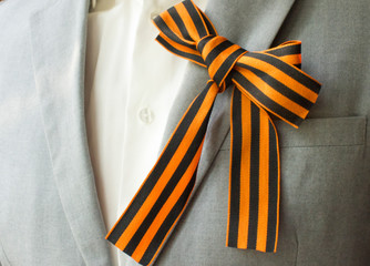 Saint George ribbon on lapel on Victory day celebrating