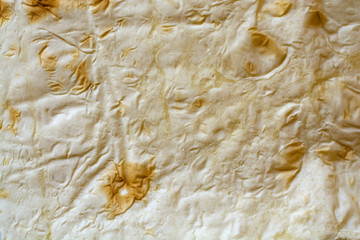 Thin pita close-up. Abstract texture background.