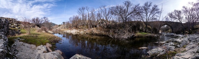  Panoramic view of the Medieval Bridge of Matafrailes, over the creek of Canenciade, one of the Medieval Bridges of Lozoya, Madrid, Spain