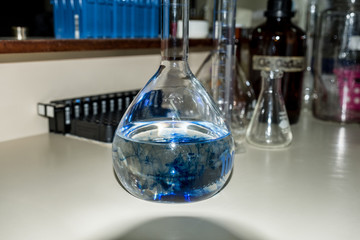 Flask with blue liquid in the laboratory