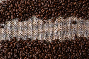 Coffee beans and sackcloth background., place for text