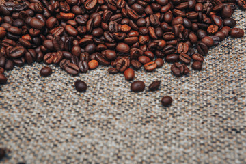 Coffee beans and sackcloth background, place for text