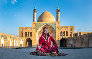 beautiful young iranian lady in a mosque