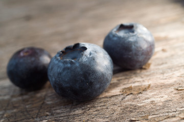 Blueberry fruit on rustic background