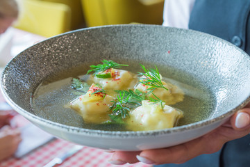 Ravioli with shrimps in broth italian food