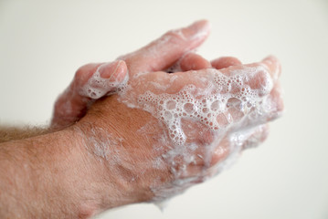 close up of man washing his hands