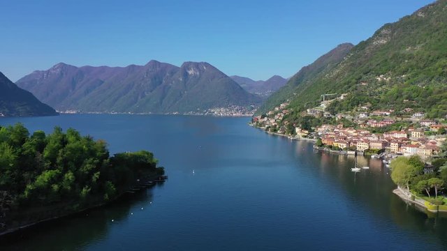 Aerial drone video of iconic village of Ossucio in lake Como one of the most beautiful and deepest in Europe, Lombardy, Italy