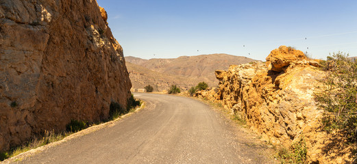 Empty and narrow road in the mountains leading from the famous tourist place Battery Castilitos