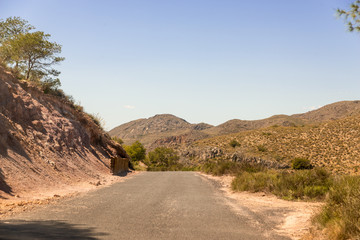 Empty and narrow road in the mountains leading from the famous tourist place Battery Castilitos