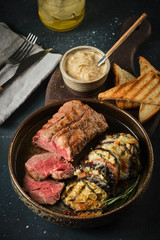 Veal tenderloin with vegetables, eggplants and tomatoes with demi-glace sauce.