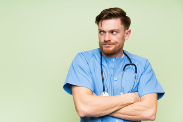 Surgeon doctor man standing and thinking an idea