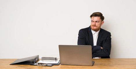 Businessman in a office with confuse face expression