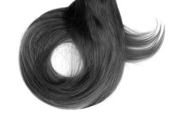 Long black hair isolated on white background. In shape of circle