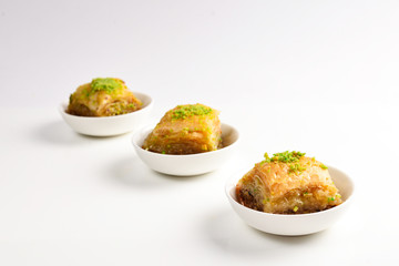Pistachio baklava on a white background. Dessert.