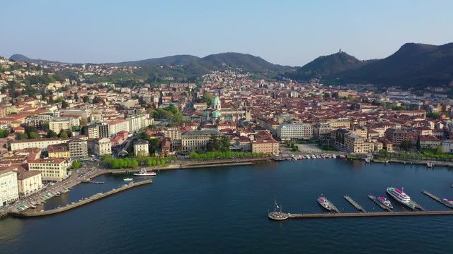 Aerial drone video of famous beautiful village of Como in lake Como one of the deepest in Europe, Lombardy, Italy