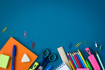 School supplies on blue background. Top view. Copy space. - Powered by Adobe