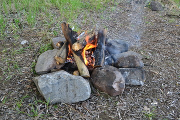 Tourist bonfire on nature in spring.