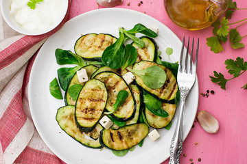 Grilled zucchini courgette with feta cheese and garlic
