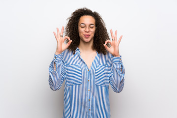 Dominican woman with striped shirt in zen pose