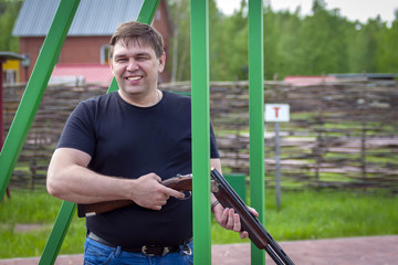 Fototapeta premium A man with a sports rifle at the shooting range.