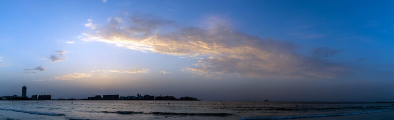 Fototapeta na wymiar dramatic evening cloudy sky and sunset view over Dubai, United Arab Emirates