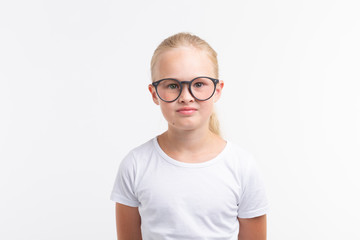 Beautiful child girl wearing glasses isolated on white