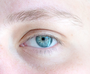 Young girl beautiful clear blue eye close up