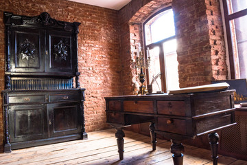 Fototapeta na wymiar Suite in the old style with the Cabinet, an antique writing Desk