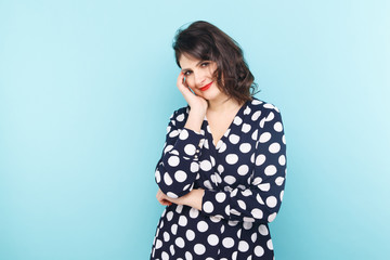 Young model posing on the blue background