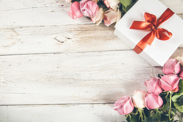 roses with gift box on desk