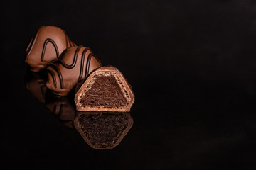 Chocolate on glass with reflection. It can be used as a background