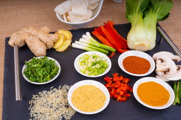 Asian Food Ingredients.  Selection of Asian food ingredients ready for preparation of a meal, presented on a slate platter.