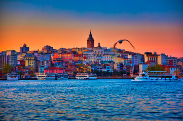 Fototapeta na wymiar View of the Istanbul City of Turkey. Historical Galata Tower and sunset at Bosphorus.