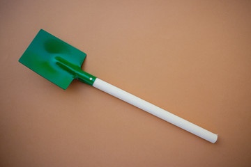 Vintage metal baby toy shovel with wooden handle