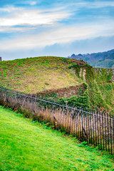 The brick wall of boundary at dover castle and with green grass